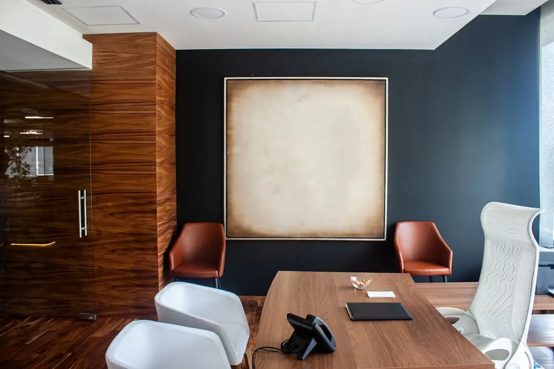 Modern wood-paneled office with a polished conference table